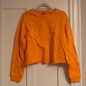 Neon orange ASOS cropped sweatshirt